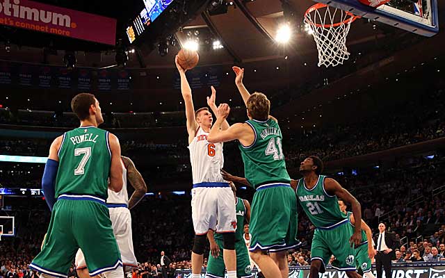 Rookie Kristaps Porzingis thrived while dueling with Mavs star Dirk Nowitzki.