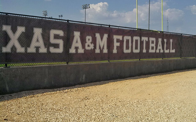 Somewhere behind this fence, there is a 6-foot-5, 245-pound freshman wide receiver. (Gregg Doyel)