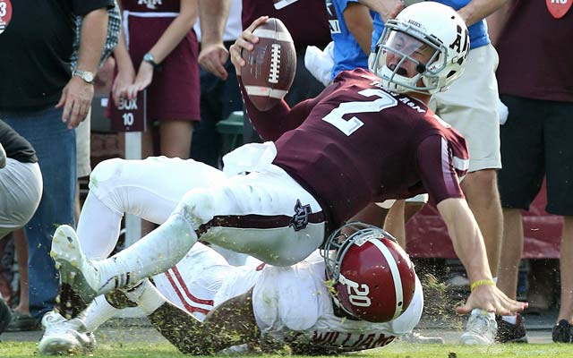 Johnny Manziel boosts his Heisman stock while Alabama notches another victory. (USATSI)