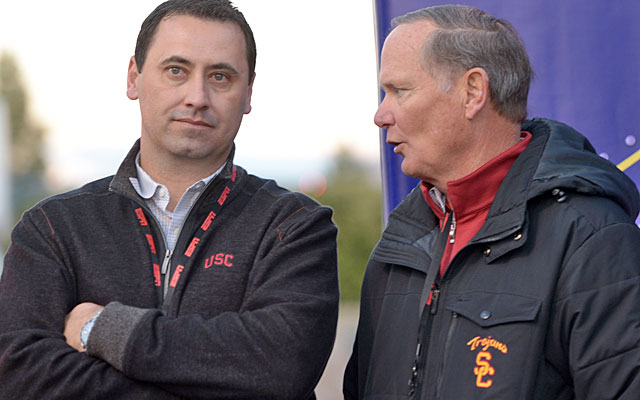 Steve Sarkisian (left, with AD Pat Haden) is the latest coach to attempt to trademark his name. (USATSI)