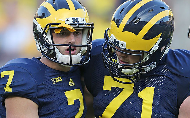 Michigan QB Shane Morris needed Wolverines OL Ben Barden's help to stay upright Saturday. (Getty Images)
