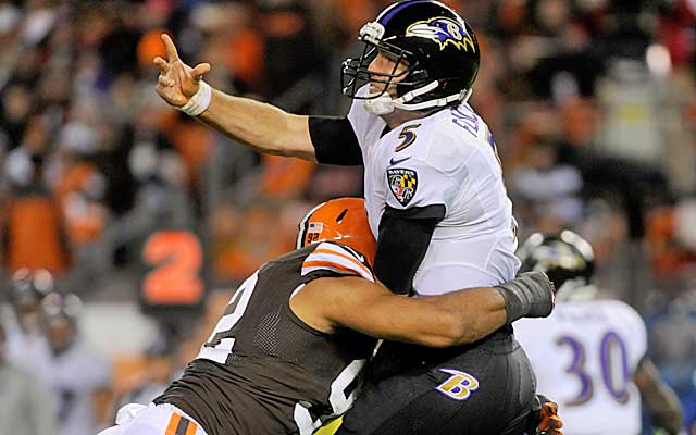 Joe Flacco continues to get pounded behind a struggling offensive line in Baltimore. (USATSI)