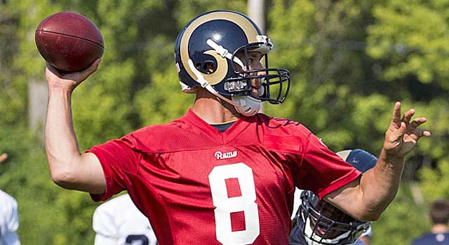 St. Louis Rams starting quarterback Sam Bradford (8) hands the