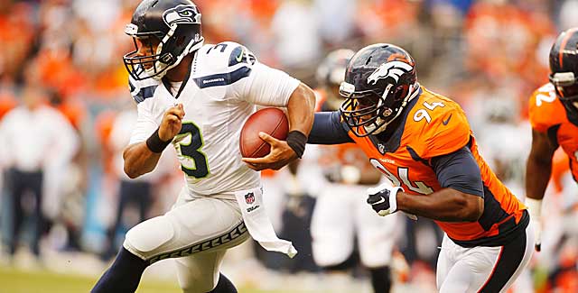 Already a presence DeMarcus Ware sacks Russell Wilson in Denver's preseason opener. (USATSI)