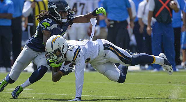 Richard Sherman moves in to make a tackle as Chargers WR Keenan Allen dives for yardage. (USATSI)