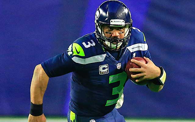 Russell Wilson was under pressure more than any other NFL quarterback last season.  (Getty Images)