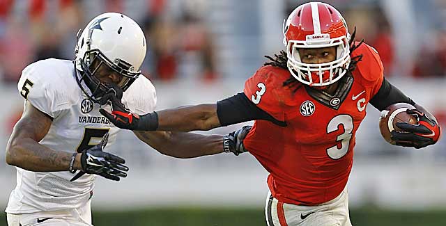 Georgia's Todd Gurley stiff-arms his way into the first round at No. 17. (Getty Images)