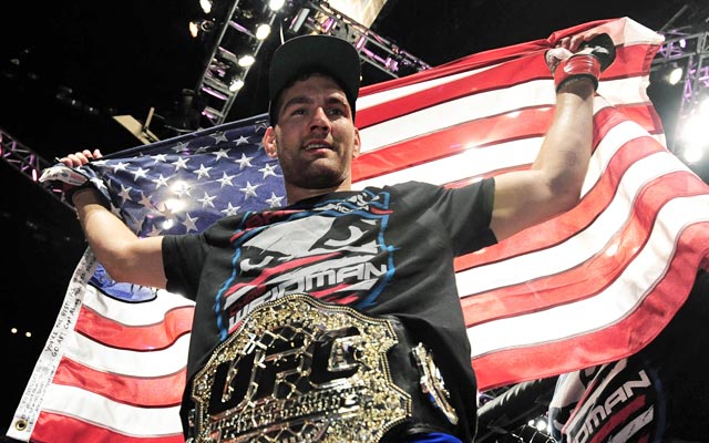 Chris Weidman shows off the red, white and blue after his victory. (USATSI)