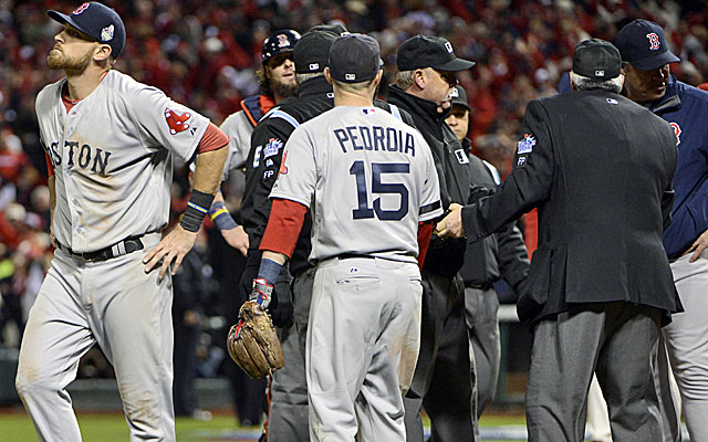 St. Louis Cardinals pitcher Carlos Martinez talks to catcher Yadier Molina  after Martinez threw a wild pitch in the ninth inning against the Boston  Redsox during game one of the World Series